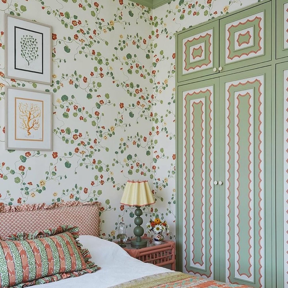 Wallpapered living space with a refined mural wall